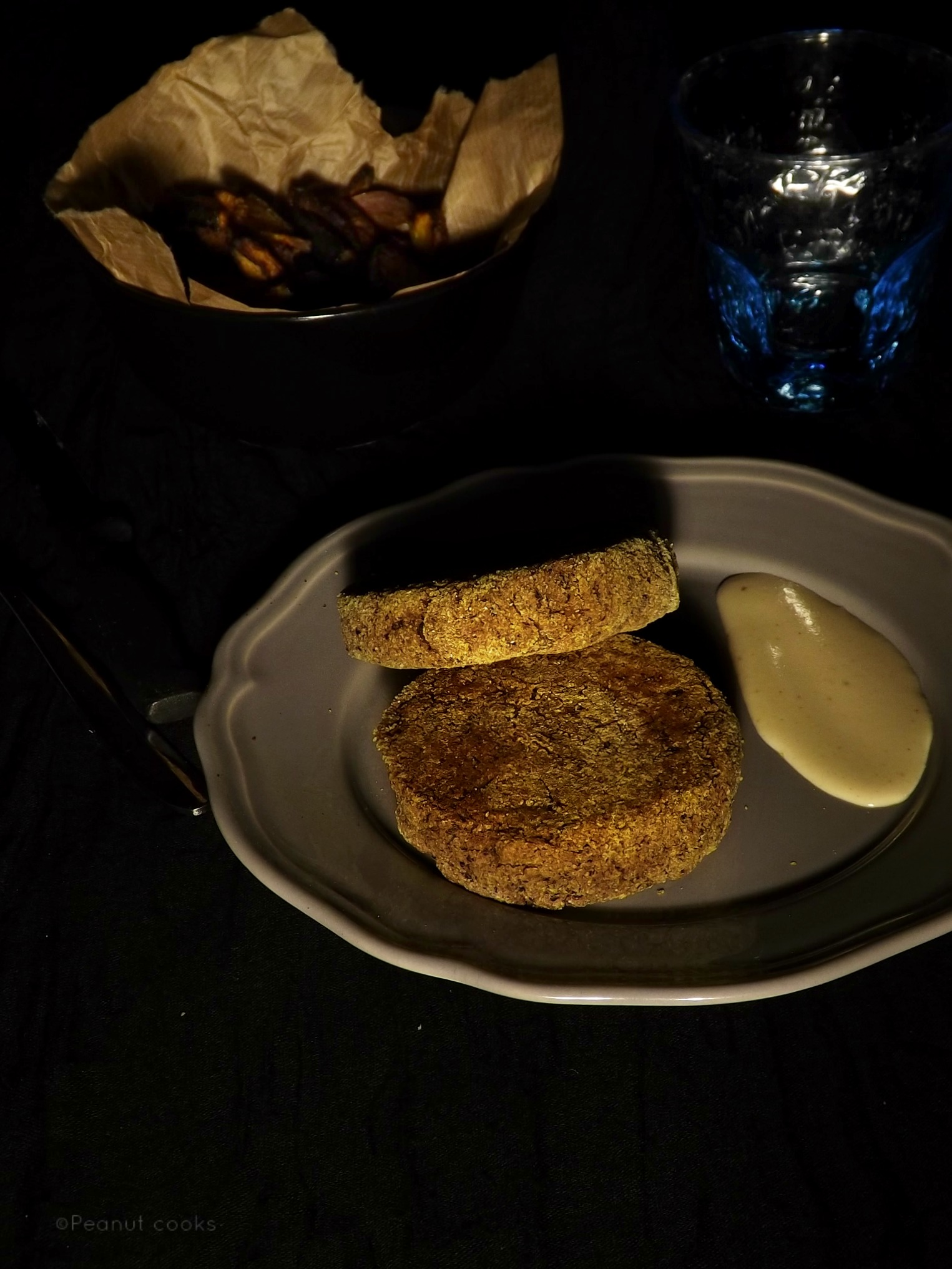 Black beans and rice burger with smoked kabocha squash chips and tahin sauce