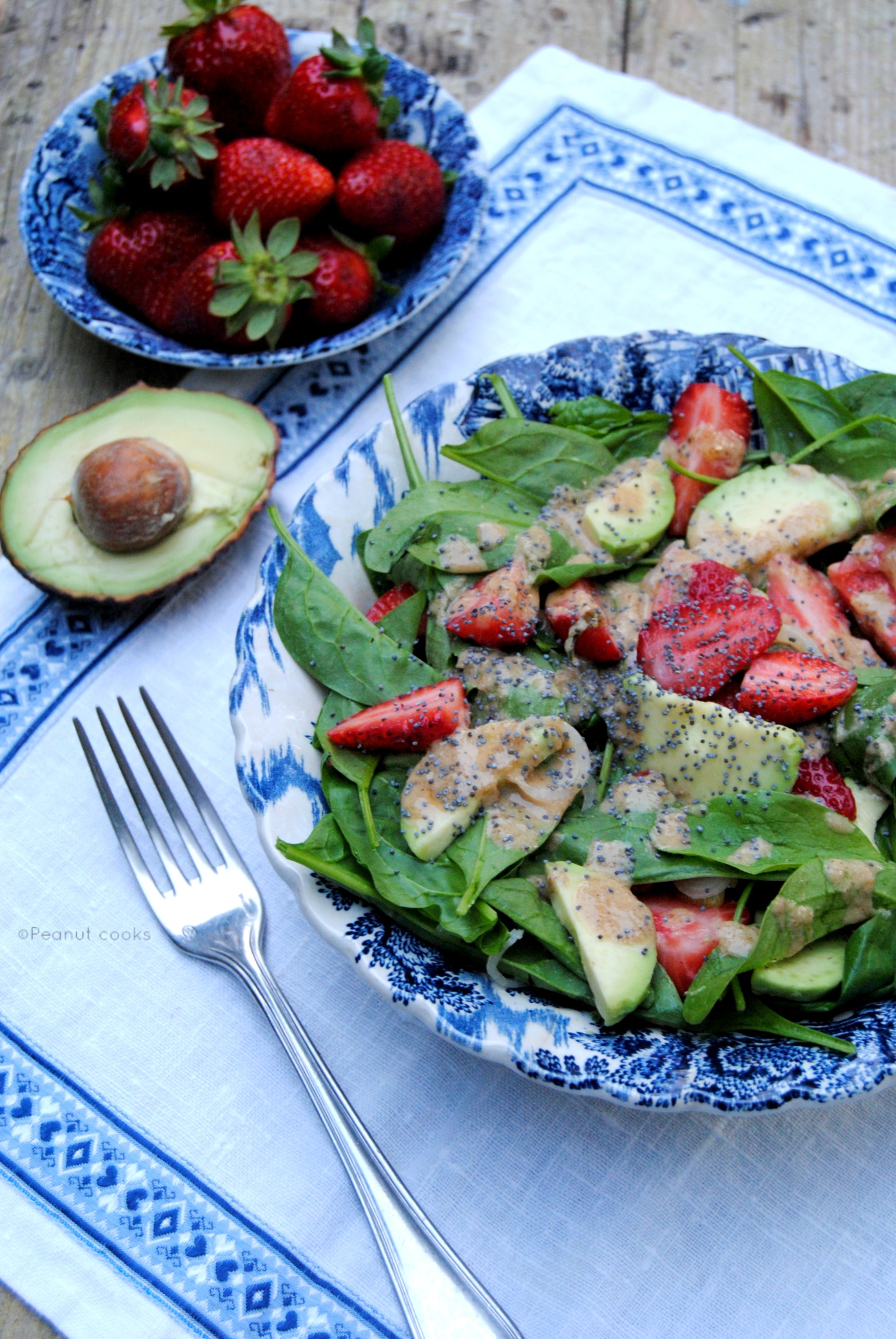 Spinach, strawberry and avocado salad with orange tahin dressing